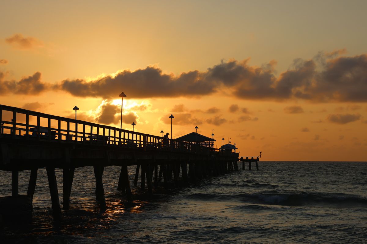 A Pier With A Sunset