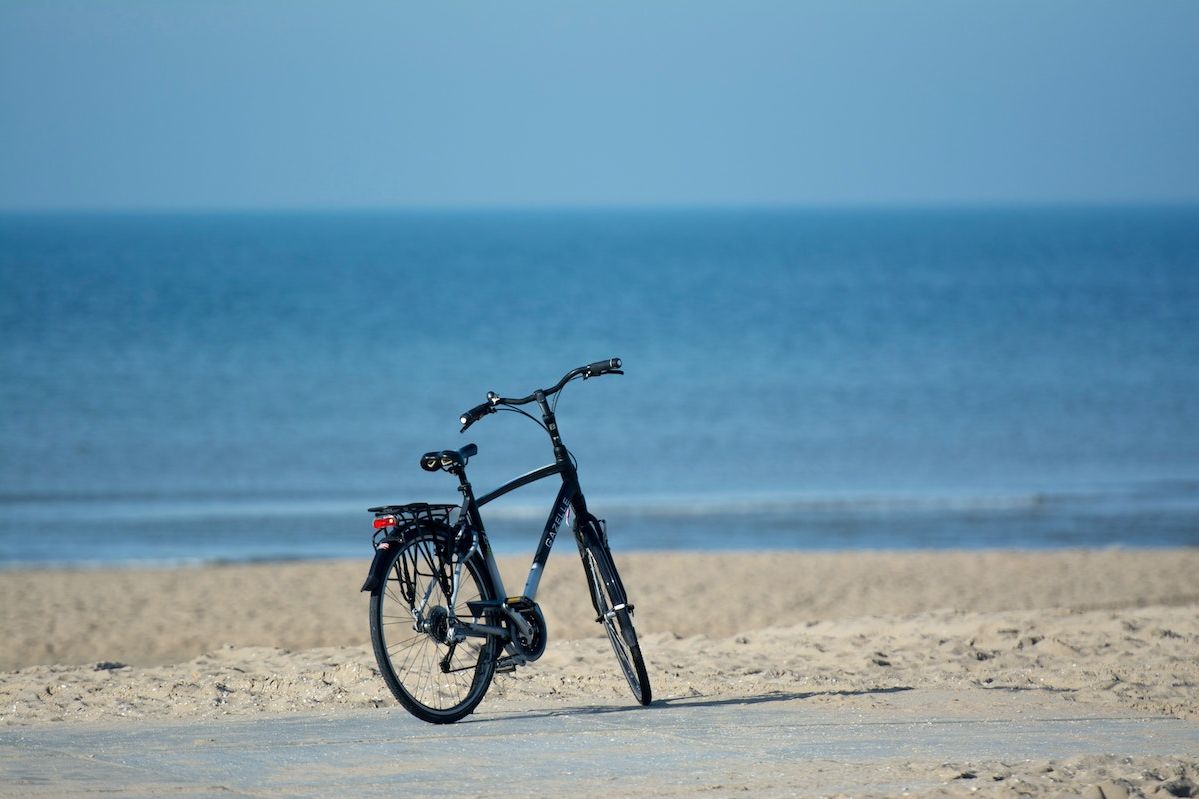 A Bicycle Parked On A Beach